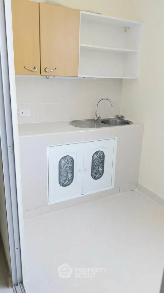 Compact kitchen with closed layout and modern cabinetry