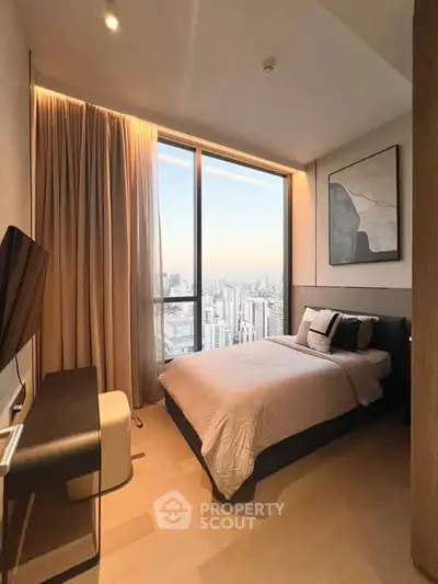 Luxurious bedroom with stunning city view, modern decor, and floor-to-ceiling windows in high-rise apartment.