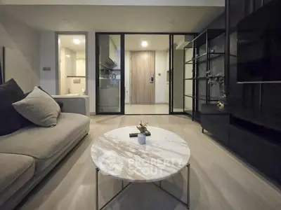 Modern living room with elegant marble coffee table and cozy sofa, showcasing sleek interior design.
