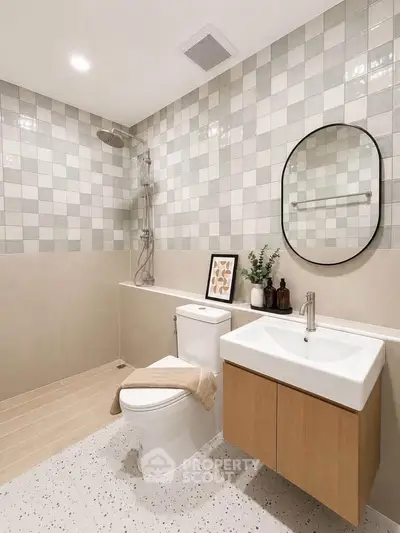 Modern bathroom with stylish tiles, sleek fixtures, and elegant decor for a contemporary living experience.