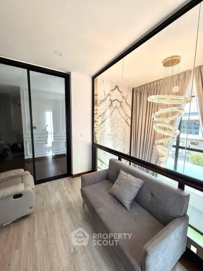 Stylish modern living area with elegant lighting and cozy seating
