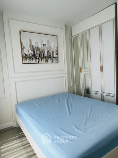 Spacious bedroom with modern decor and large wardrobe