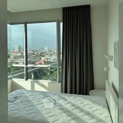 Bright bedroom with panoramic city view and modern decor