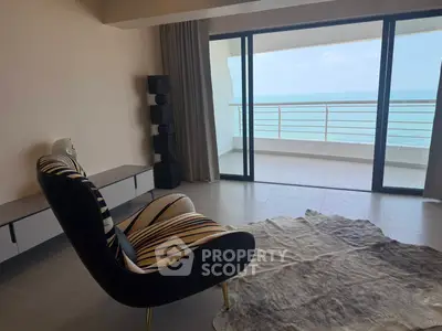 Luxurious living room with ocean view and stylish furniture in modern apartment
