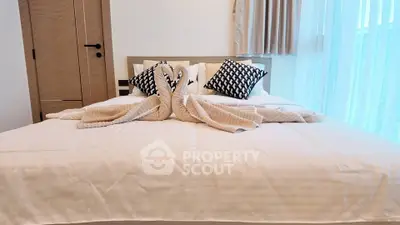 Luxurious bedroom with elegant decor and natural light, perfect for relaxation and comfort.