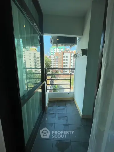 Charming balcony with city view, perfect for relaxation and enjoying the urban landscape.