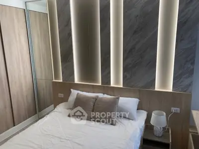 Modern bedroom with stylish lighting and cozy decor