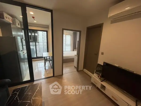 Modern apartment interior with open layout and balcony view
