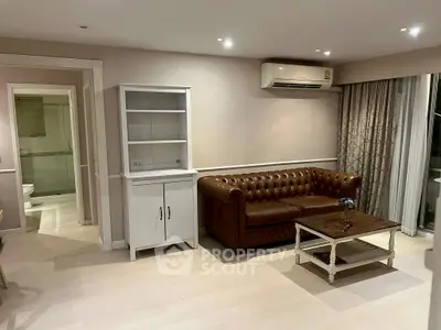 Charming living room with leather sofa and air conditioning in modern apartment.