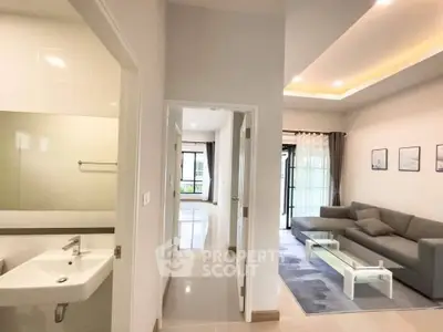 Modern open-layout living room with sleek design and natural light