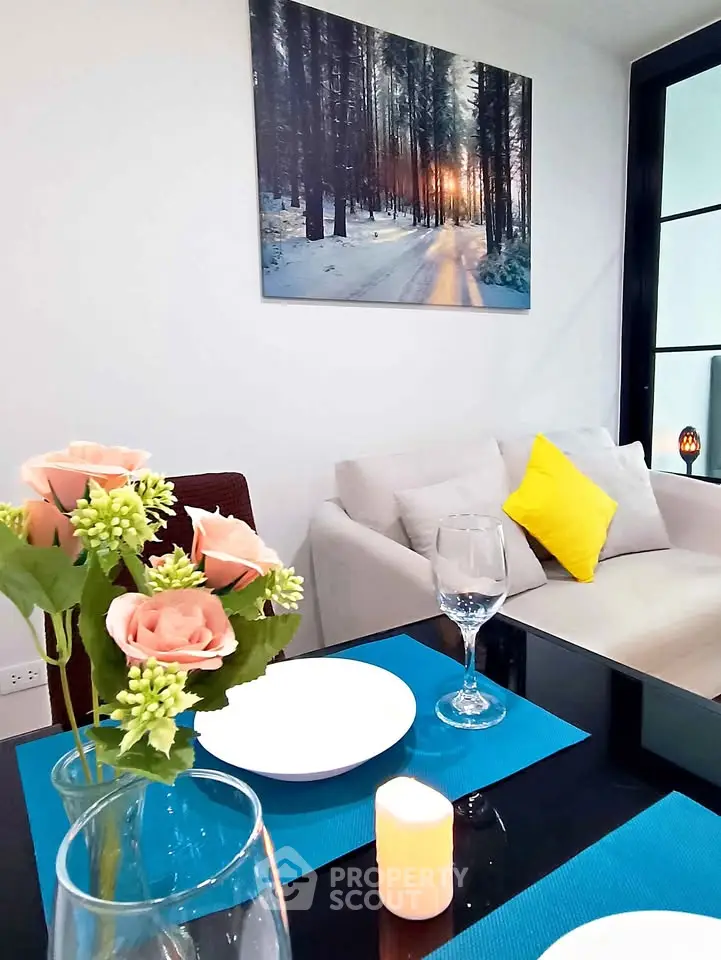 Chic modern living room with elegant dining setup and cozy sofa, perfect for stylish urban living.