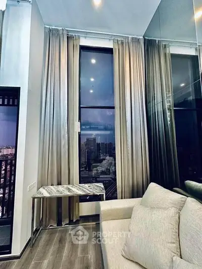 Luxurious high-rise living room with floor-to-ceiling windows and stunning city view.