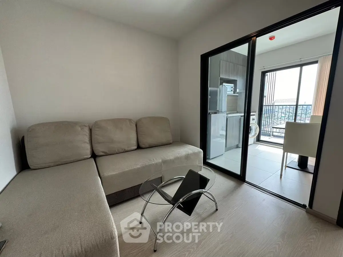 Modern living room with balcony view and sleek furniture