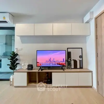 Modern living room with sleek TV setup and stylish decor