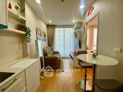 Charming modern living room with cozy seating and stylish decor, perfect for relaxation and entertaining.