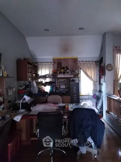 Cozy home office with ample storage and natural light, perfect for productivity and comfort.