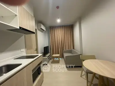 Modern living room with open kitchen in stylish apartment