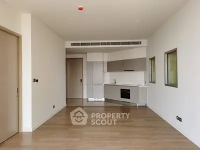 Spacious modern apartment with open kitchen and wooden flooring