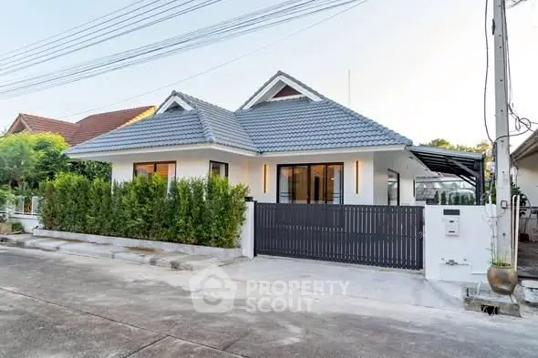 Charming single-story house with modern design and lush greenery