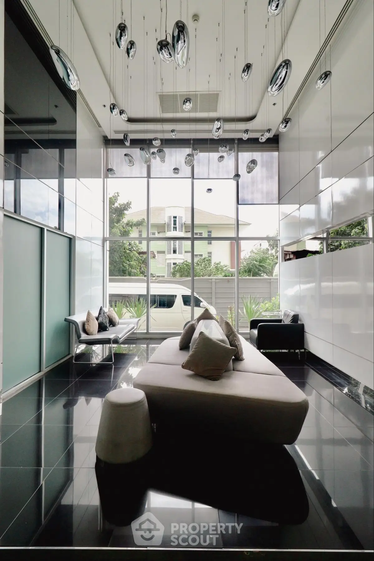 Luxurious modern living room with high ceilings and elegant lighting