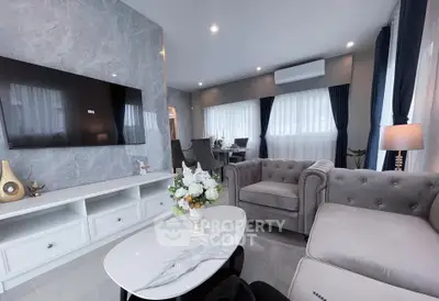 Luxurious modern living room with elegant decor and ample natural light