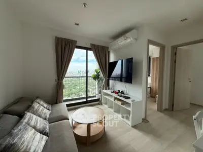 Modern living room with balcony view in high-rise apartment