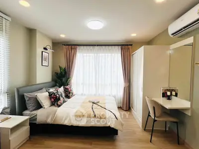 Modern bedroom with stylish decor, featuring a cozy bed, elegant curtains, and a sleek workspace.