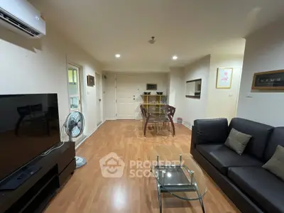 Spacious living room with modern furniture and wooden flooring