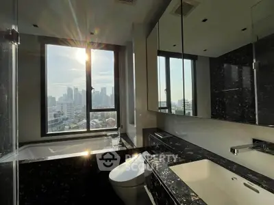 Luxurious bathroom with city view and modern black marble design