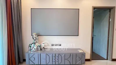 Modern interior with stylish console and abstract sculpture in a contemporary living space.