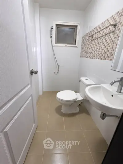 Modern bathroom with sleek fixtures and stylish tile accents