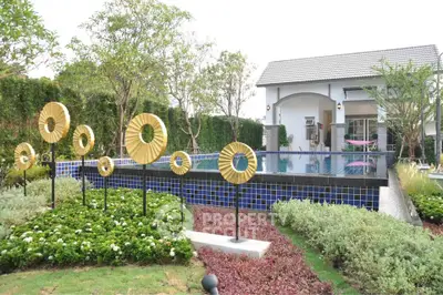 Luxurious home with modern pool and landscaped garden, perfect for relaxation and entertainment.