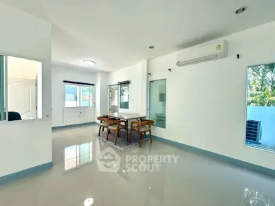Spacious modern dining area with natural light and sleek design