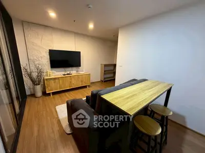 Modern living room with sleek furniture and wooden flooring