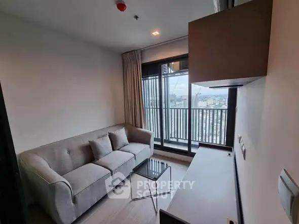 Modern living room with cozy sofa and city view balcony in a stylish apartment.
