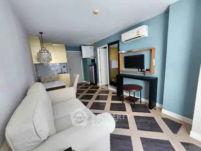 Modern living room with stylish decor and open kitchen layout