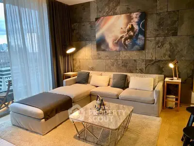 Stylish living room with modern decor and large windows offering city views.