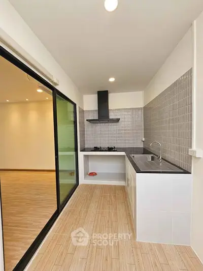 Modern kitchen with sleek design and gas stove in open layout apartment