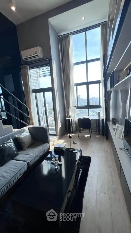 Luxurious high-ceiling living room with stunning city view and modern decor