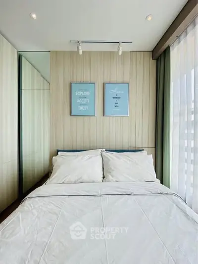 Modern bedroom with stylish decor and natural light