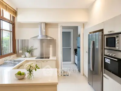 Modern kitchen with stainless steel appliances and sleek design