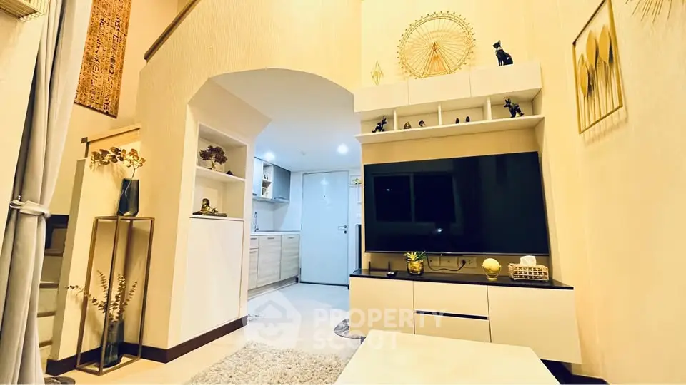 Stylish living room with modern decor and open kitchen layout