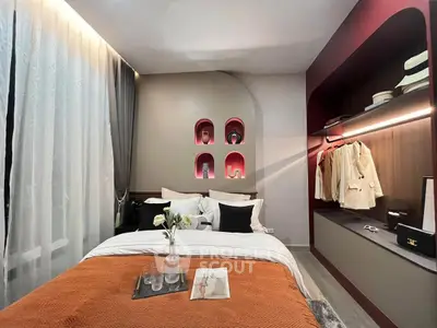 Stylish bedroom with modern decor and built-in closet, perfect for cozy living.