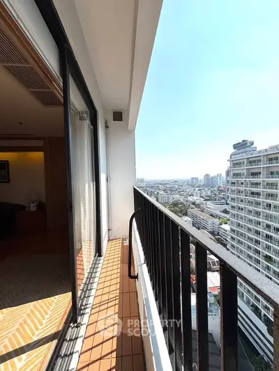 Stunning high-rise balcony with panoramic city views and modern design.