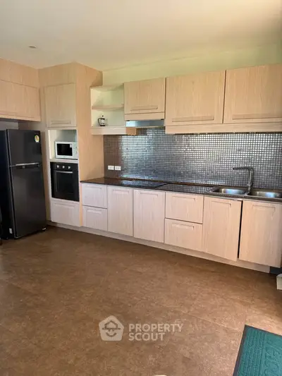 Modern kitchen with sleek cabinetry and stainless steel appliances