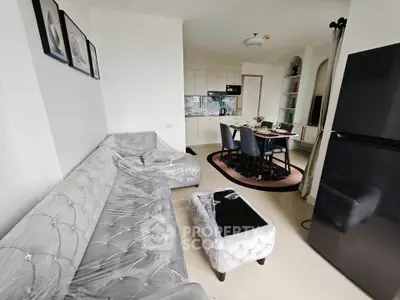 Modern living room with elegant furniture and open kitchen layout