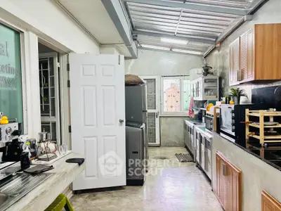 Spacious kitchen with modern appliances and open layout, featuring ample counter space and natural light.