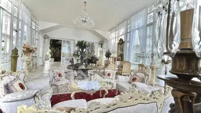 Luxurious living room with elegant vintage decor and abundant natural light