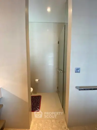 Modern bathroom with glass shower door and sleek design