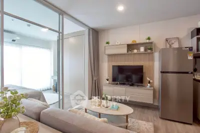 Modern living room with stylish decor and open layout, featuring a cozy sofa and sleek TV unit.